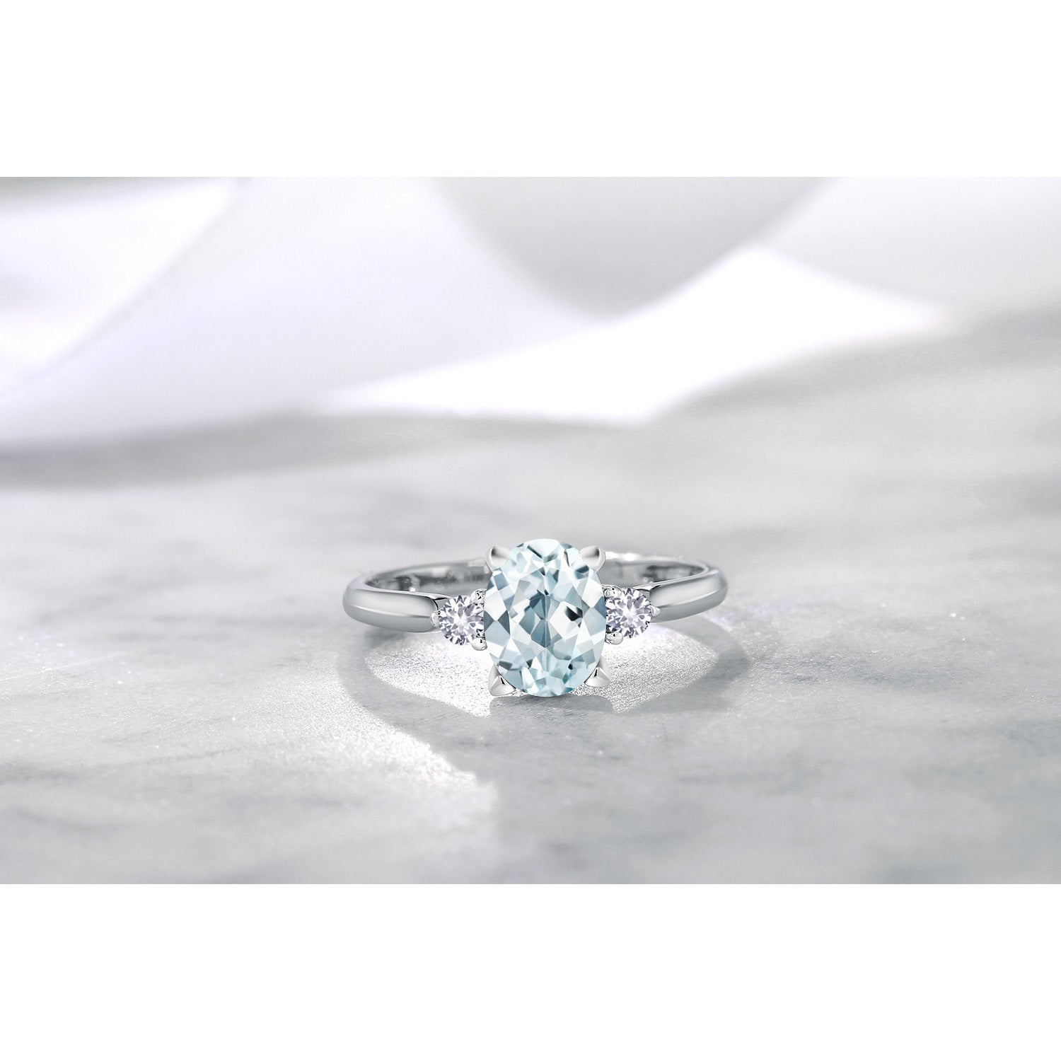 10K White Gold Sky Blue Aquamarine and White Created Sapphire 3-Stone Engagement Ring For Women (1.20 Cttw, Gemstone Birthstone, Available in size 5, 6, 7, 8, 9)