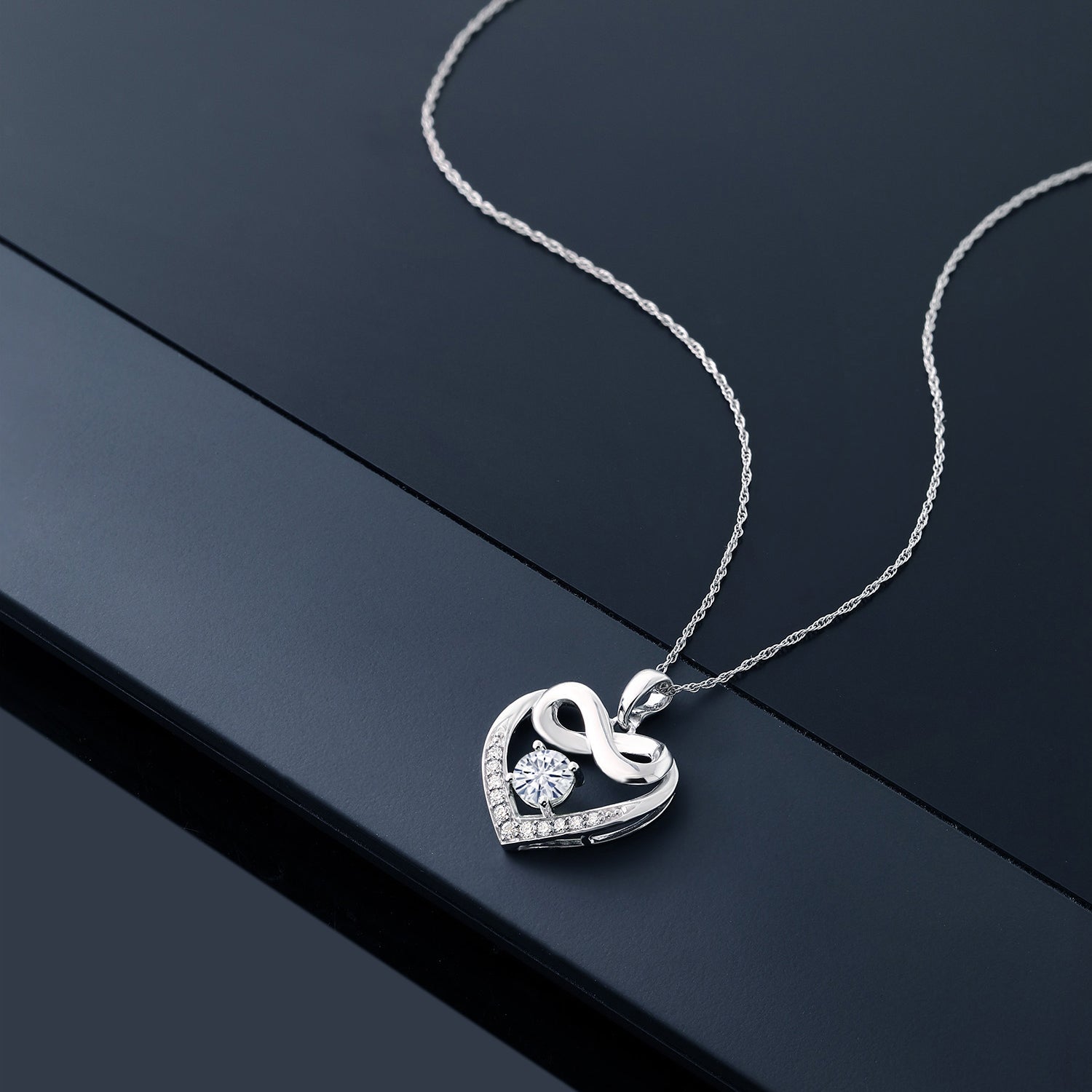 10K White Gold White Moissanite and White Lab Grown Diamond Heart and Infinity Pendant Necklace For Women (0.92 Cttw, Round 5MM, with 18 Inch Silver Chain)