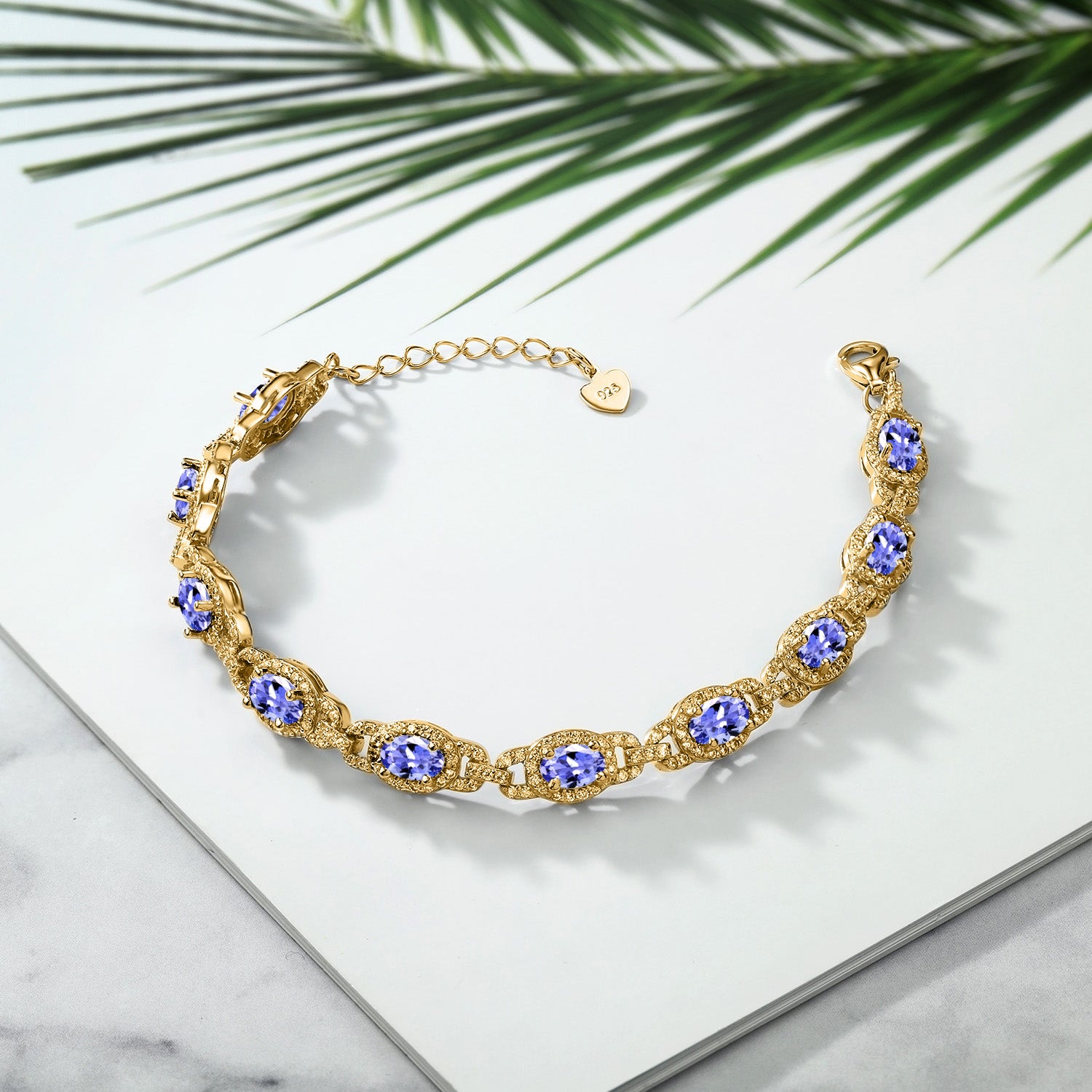 18K Yellow Gold Plated Silver Blue Tanzanite Tennis Bracelet For Women (8.55 Cttw, Oval 6X4MM, Gemstone Birthstone, 7 Inch With 1 Inch Extender)