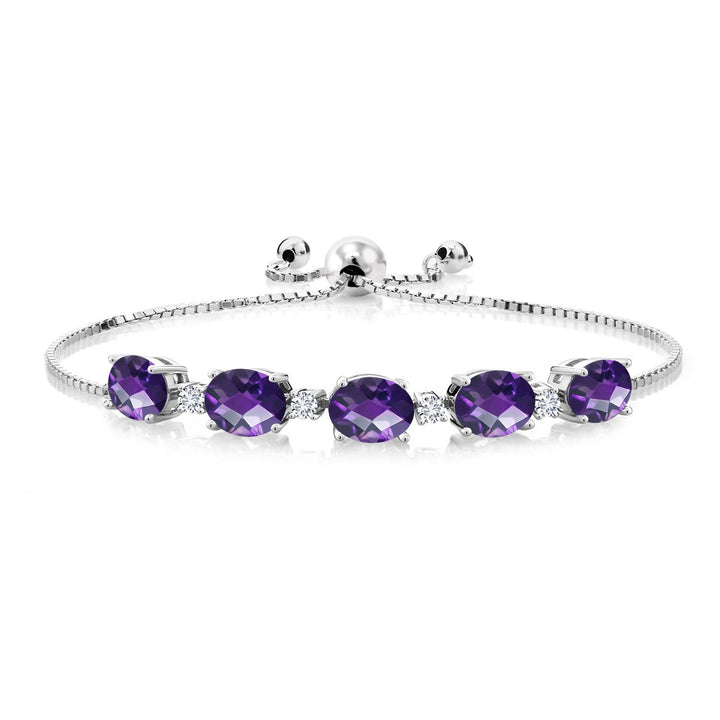 Sterling silver adjustable bolo bracelet featuring five oval purple gemstones and small accent diamonds