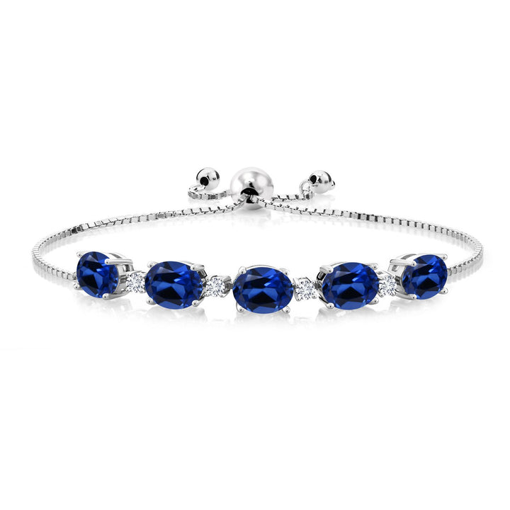 Silver adjustable bolo bracelet featuring five oval blue sapphires alternating with small white diamonds