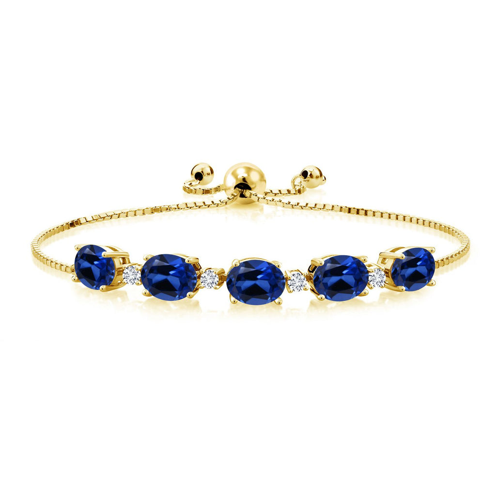 Gem Stone King 18K Yellow Gold Plated Silver Gemstone Birthstone and White Lab Grown Diamond Tennis Bracelet for Women | Oval 8X6MM with Round 2.5MM Accents | Adjustable Bolo Chain | Fine Jewelry for Her Mom Wife