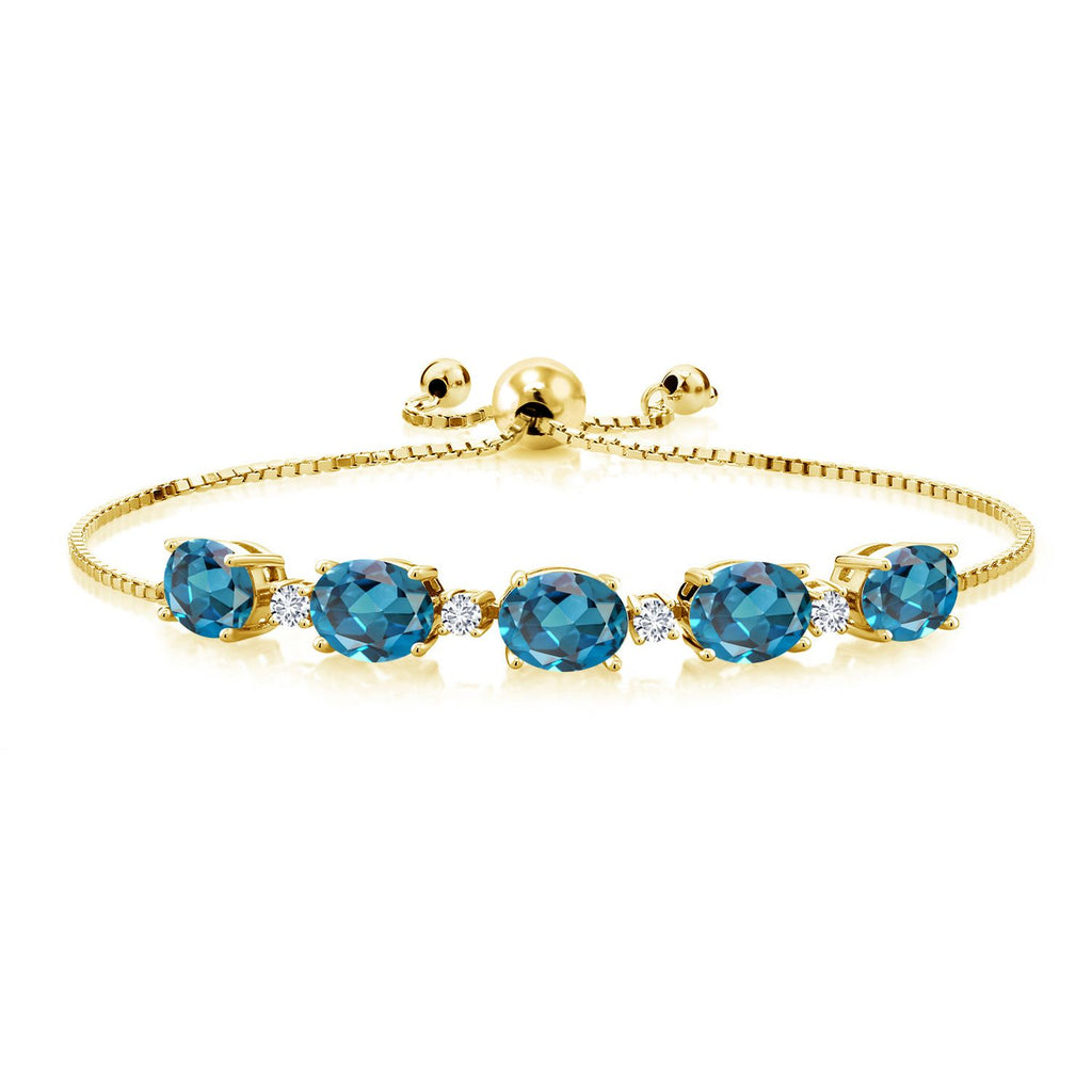 Gem Stone King 18K Yellow Gold Plated Silver Gemstone Birthstone and White Lab Grown Diamond Tennis Bracelet for Women | Oval 8X6MM with Round 2.5MM Accents | Adjustable Bolo Chain | Fine Jewelry for Her Mom Wife