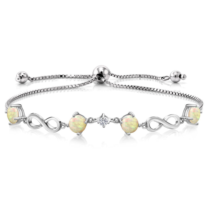 Gem Stone King 925 Sterling Silver Gemstone Birthstone and Lab Grown Diamond Infinity Bracelet for Women | Round 5MM Gemstones with 2.5MM Accent Stones | Elegant Infinity Link Design | Adjustable up to 9 Inch