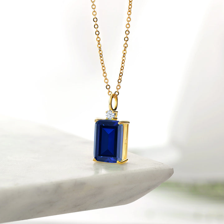 18K Yellow Gold Plated Silver Blue Created Sapphire Pendant Necklace For Women (10.11 Cttw, Emerald Cut 14X10MM, with 18 Inch Chain)