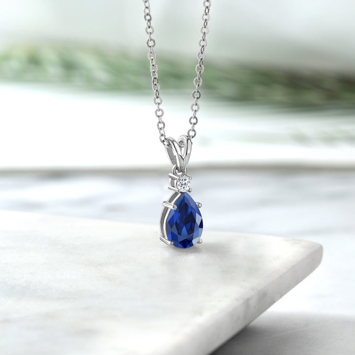 925 Sterling Silver Blue Created Sapphire and White Topaz Pendant Necklace For Women (1.09 Cttw, Gemstone September Birthstone, Pear Shape 9X6MM, with 18 inch Chain)