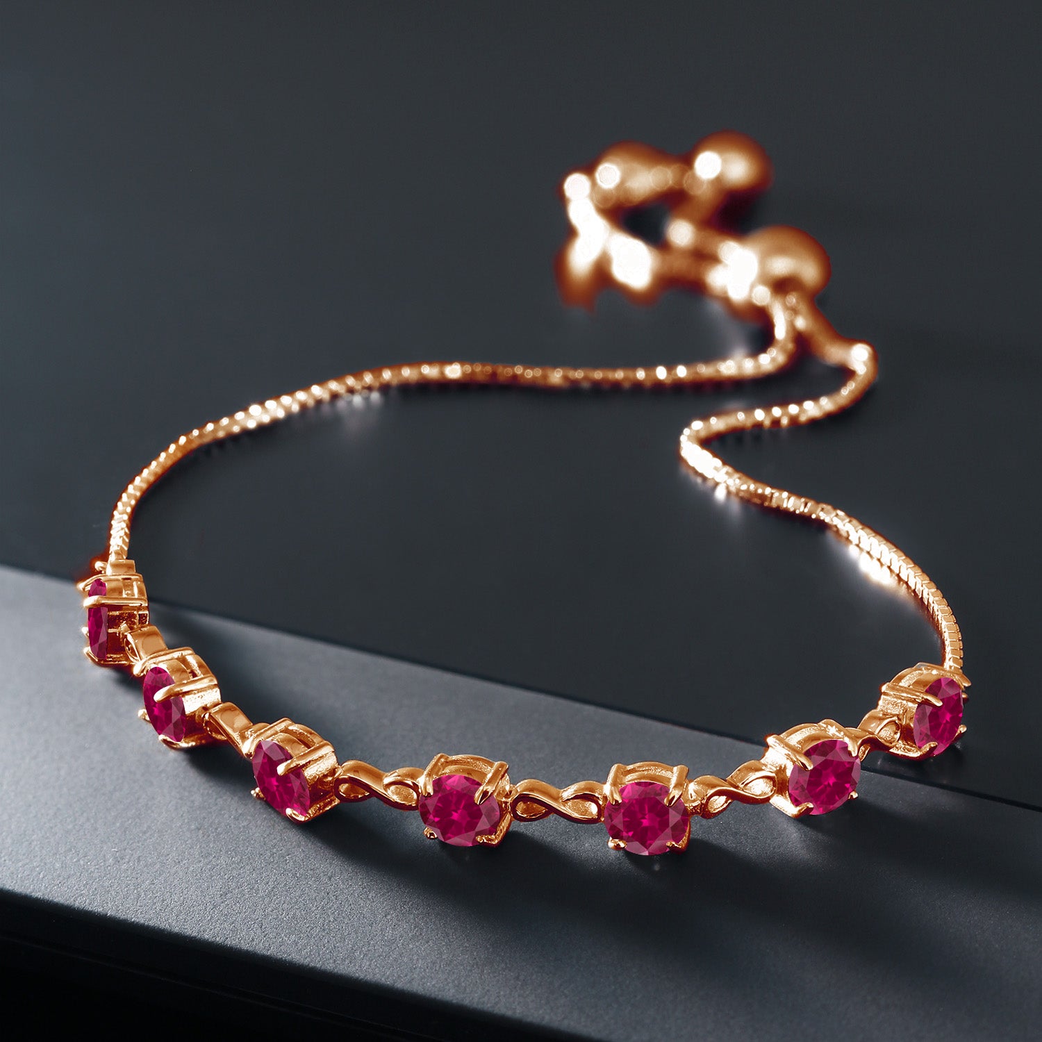 18K Rose Gold Plated Silver Red Created Ruby Infinity Tennis Bracelet For Women (2.80 Cttw, Gemstone July Birthstone, Round 4.5MM, Fully Adjustable Up to 9 Inch)