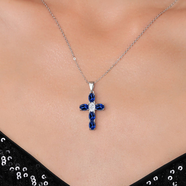 925 Sterling Silver Blue Created Sapphire and White Moissanite Cross Pendant Necklace for Women | 3.50 Cttw | Gemstone September Birthstone | Oval 6X4MM | With 18 Inch Chain